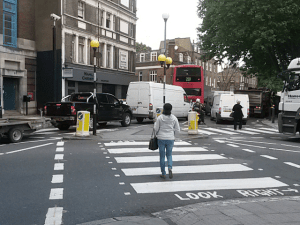 Acton Street Junction with Gray's Inn Road. Traffic is stationery (was was all the traffic in these photos). The car has a trailer and totally blocks the crossing