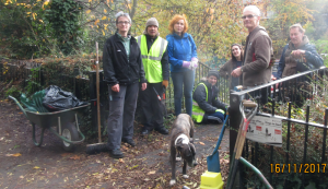 Photo of the London Wildlife volunteers hard at work on the raised path above the canal, on the Islington side, at King's Cross.